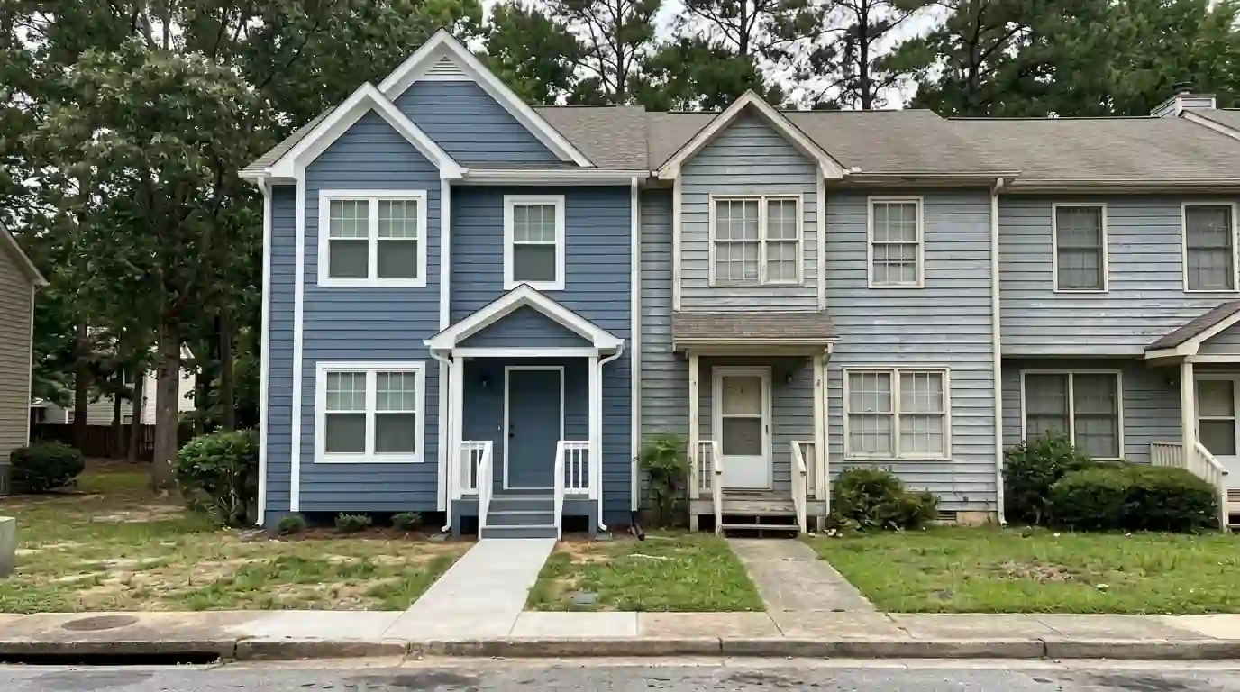 Townhome row partway through a repaint