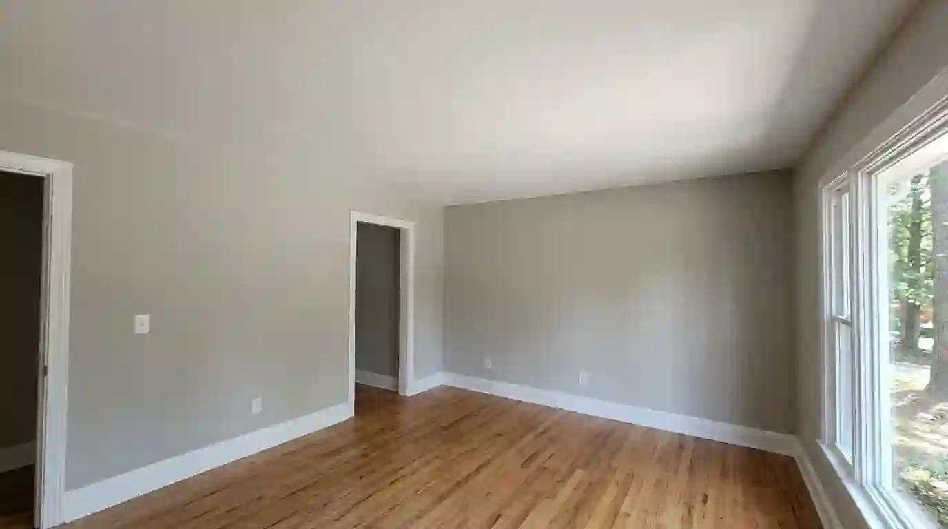 Smooth painted ceiling after popcorn removal in a Lilburn home