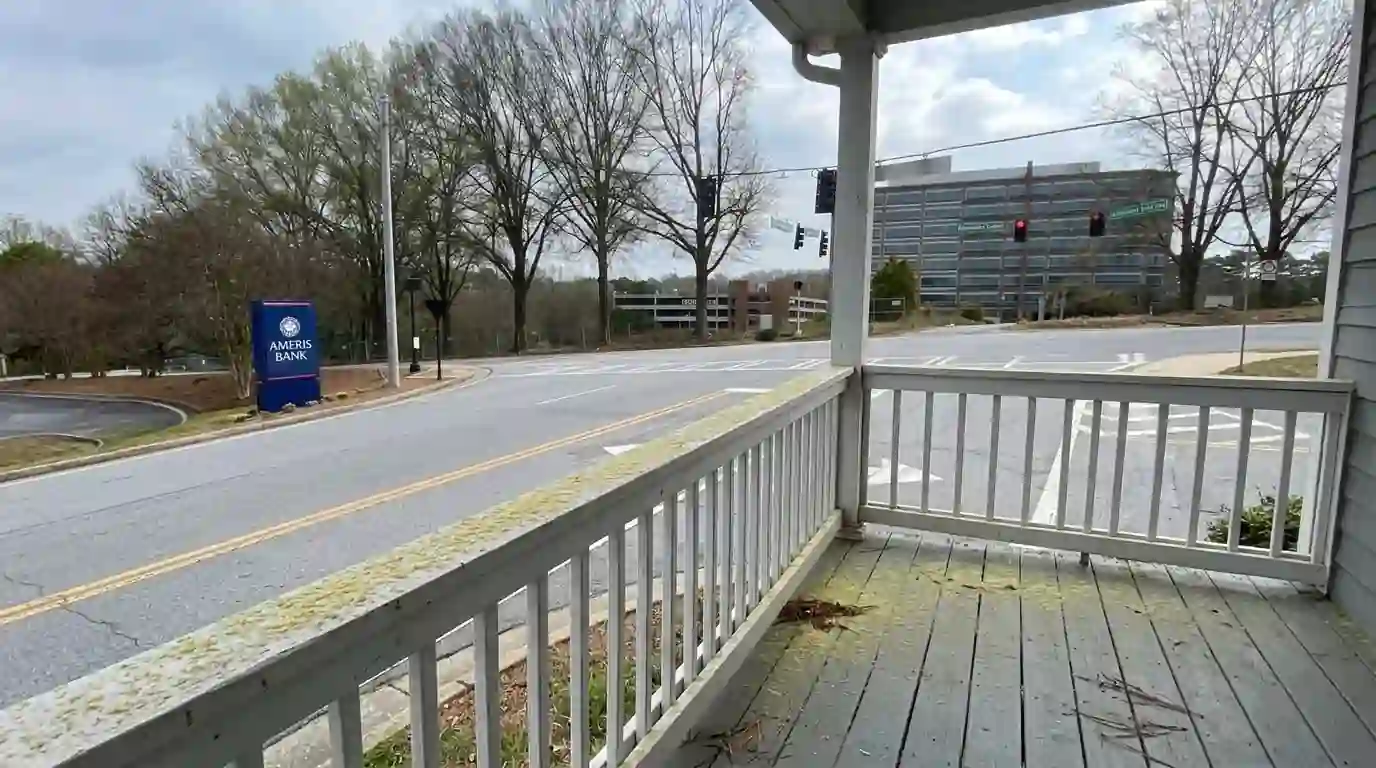Pine pollen dusting a porch floor and railing