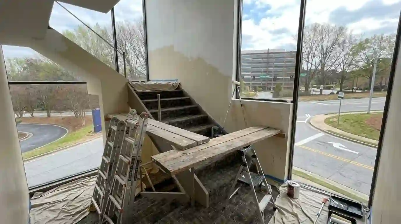 Ladder and planks across stairs in a tall stairwell